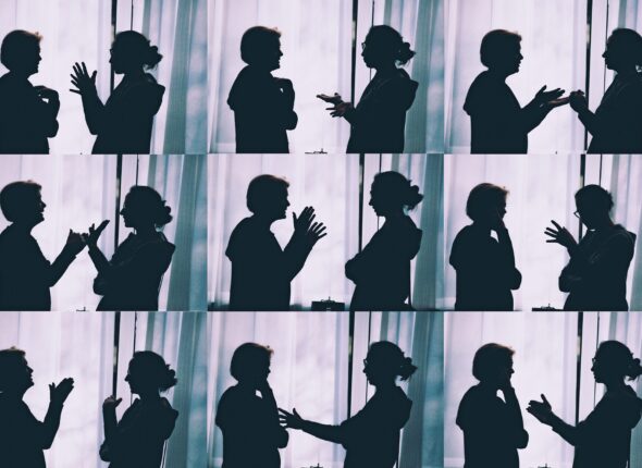 The image shows two people engaging in conversation in IELTS speaking while identifying and rectifying their errors through self-correction